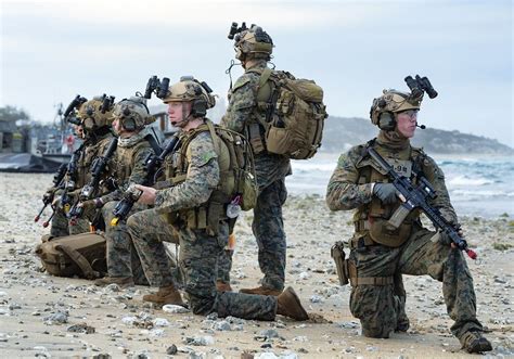 A Force Recon Marine With Ii Mef Force Recon Company Rises Out Of The Surf The Marine Is Wearing A Closed Circuit Rebreather System Which Allows The Wearer To Breath Submerged Down To
