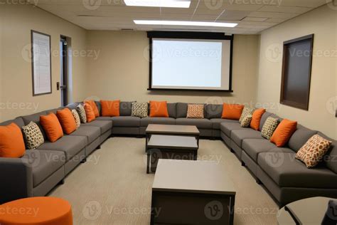 A Modern Lounge Area Featuring A Circular Sofa And Tables Designed For Relaxation Or Meetings