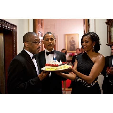 President Barack Obama And Michelle Obama Present A Birthday Cake To Assistant Usher Reggie